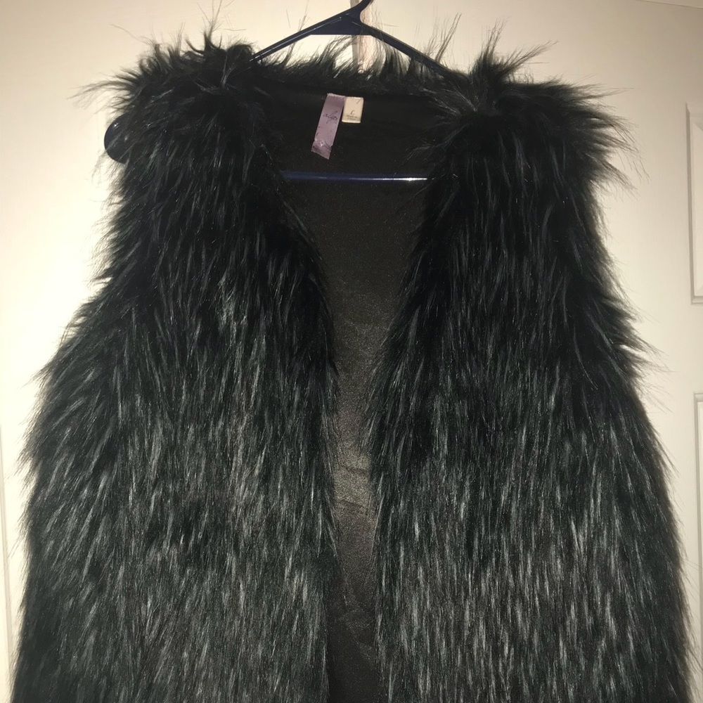 Black faux fur vest.